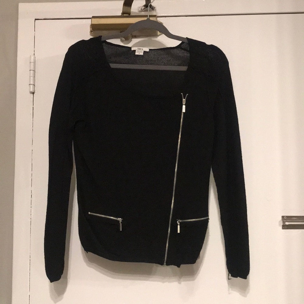Black sweater with zipper detailing.